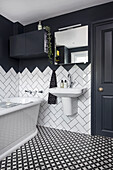 Black and white bathroom, wall mounted cabinet and wall in the same color