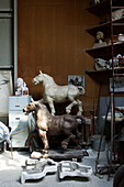 Horse statues and busts in a studio