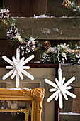 Christmas DIY snowflake decoration made from wooden sticks