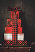 Wrapped Christmas presents with buffalo plaid ribbon