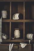 Wooden spools with lace ribbon