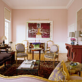 Large painting in the pink drawing room with a mixture of upholstery fabrics