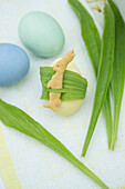 Bunny biscuits with ribwort on an Easter egg