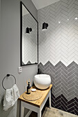 Guest bathroom with chevron wall tiles