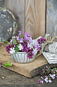 Lilac blossoms in a vintage tin bowl