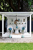 Gazebo with white lacquered vintage wicker furniture