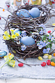 Birch wreath with Easter eggs, jelly beans, forget me nots, primrose. and pussy willow