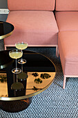 Pink sofa with elegant black table