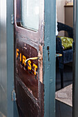 Original door of a converted Victorian railway carriage in a holiday home