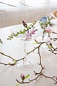 Spring branches as table decoration, magnolia blossoms