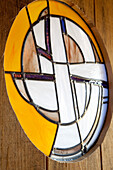 Wooden door with round stained glass window