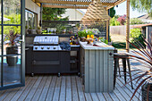 Wooden terrace with outdoor kitchen