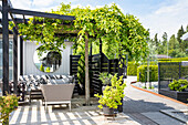 Modern patio design with pergola and seating area