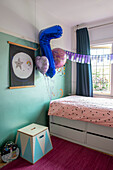 Children's room with wall decoration and balloons