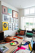 Living room with colorful carpet and picture wall