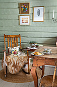 Rocking chair with fur and rustic dining table