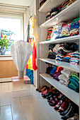 Shelves full of clothes and shoes