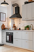 Bright kitchen with black accents and metro tiles