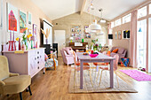 Living room with colourful furnishings and wooden flooring