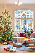 Living room decorated for Christmas with Christmas tree and presents