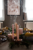 Blown out candles on a laid dining table