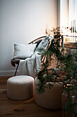 Cosy corner with armchair and poufs