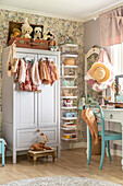 Children's room with vintage wardrobe and pastel-coloured decorative elements