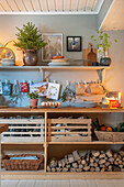 Shelf with decorations and firewood in a rustic style