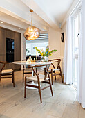Modern kitchen with dining table and pendant light