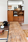 Retro sideboard with decorative items and books in the living room