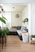 Bright room with seating area, plants and natural light