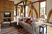 Barn conversion living area with exposed beams