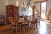 Dining area with wooden furniture in a converted barn