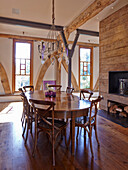 Dining area with wooden furniture in converted barn