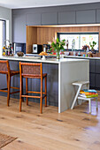 Modern kitchen with kitchen island and bar stools