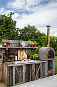 Outdoor kitchen with oven