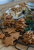 Pastries, cheese and walnuts on a rustic lattice with fir branch decorations