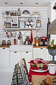 Country kitchen with open shelves and Christmas decorations