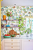 Kitchen with floral wallpaper