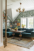 Living room with corner sofa in green, oriental rug and rope swing