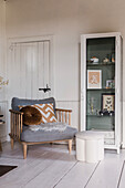 Cosy armchair with cushions and fur in the living room