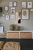 Wall design with picture frame above a sideboard in natural wood look