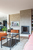 Modern living room with fireplace, glass coffee table and textured wallpaper