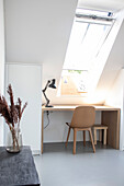 Workplace under skylight with desk lamp