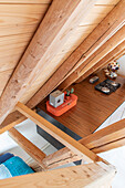 View from above of sideboard under sloping wooden ceiling