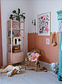 Children's room with rattan shelf and pastel-colored accessories