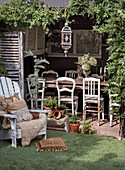 Rustic outdoor dining area with wooden furniture and plants