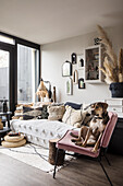 Moroccan-style living room with dog on pink chair