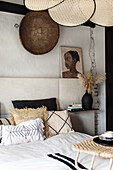 Bedroom with ethnic-style wall decor and cushions