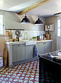 Country kitchen with antique floor tiles
